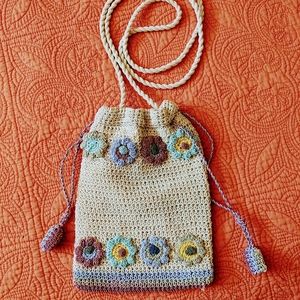 7x6 draw string purse. Perfect accessory for any gala.  Has a 47 inch strap.